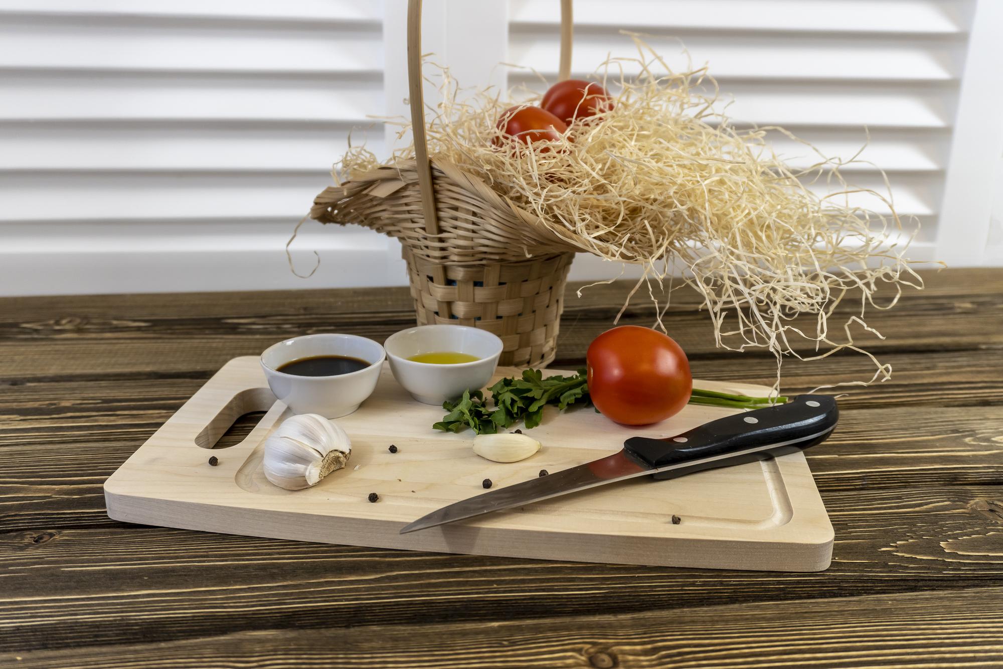 cozy kitchen workspace with cutting board and herbs