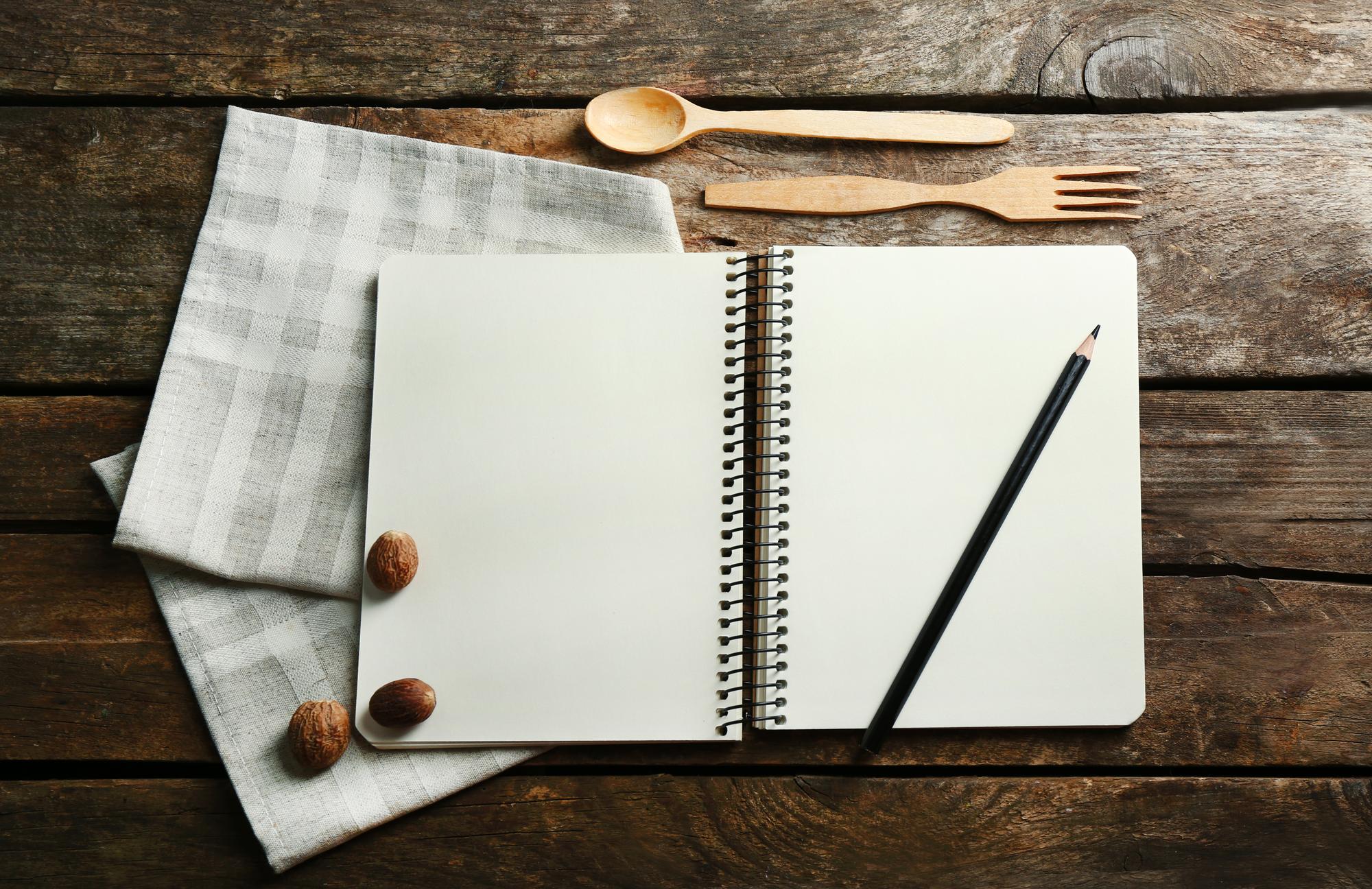notebook with menu sketches and utensils
